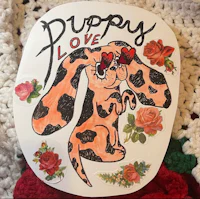 a sticker with a dog and roses on it