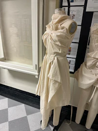 two mannequins in a room with mannequins